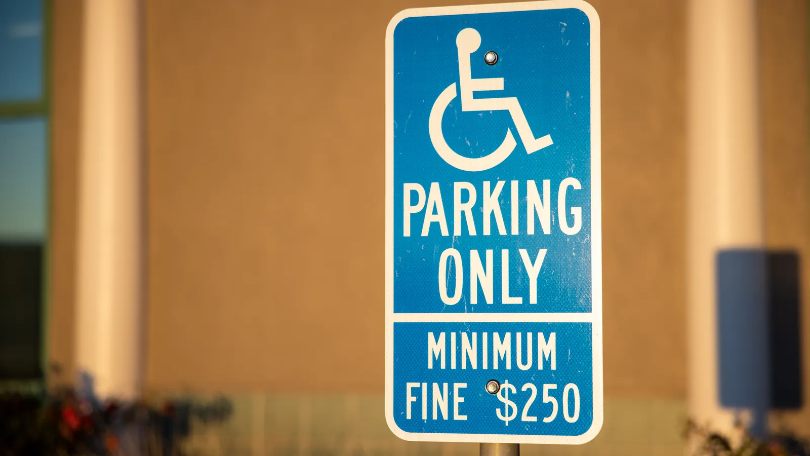 Blue sign with the wheelchair accessibility symbol