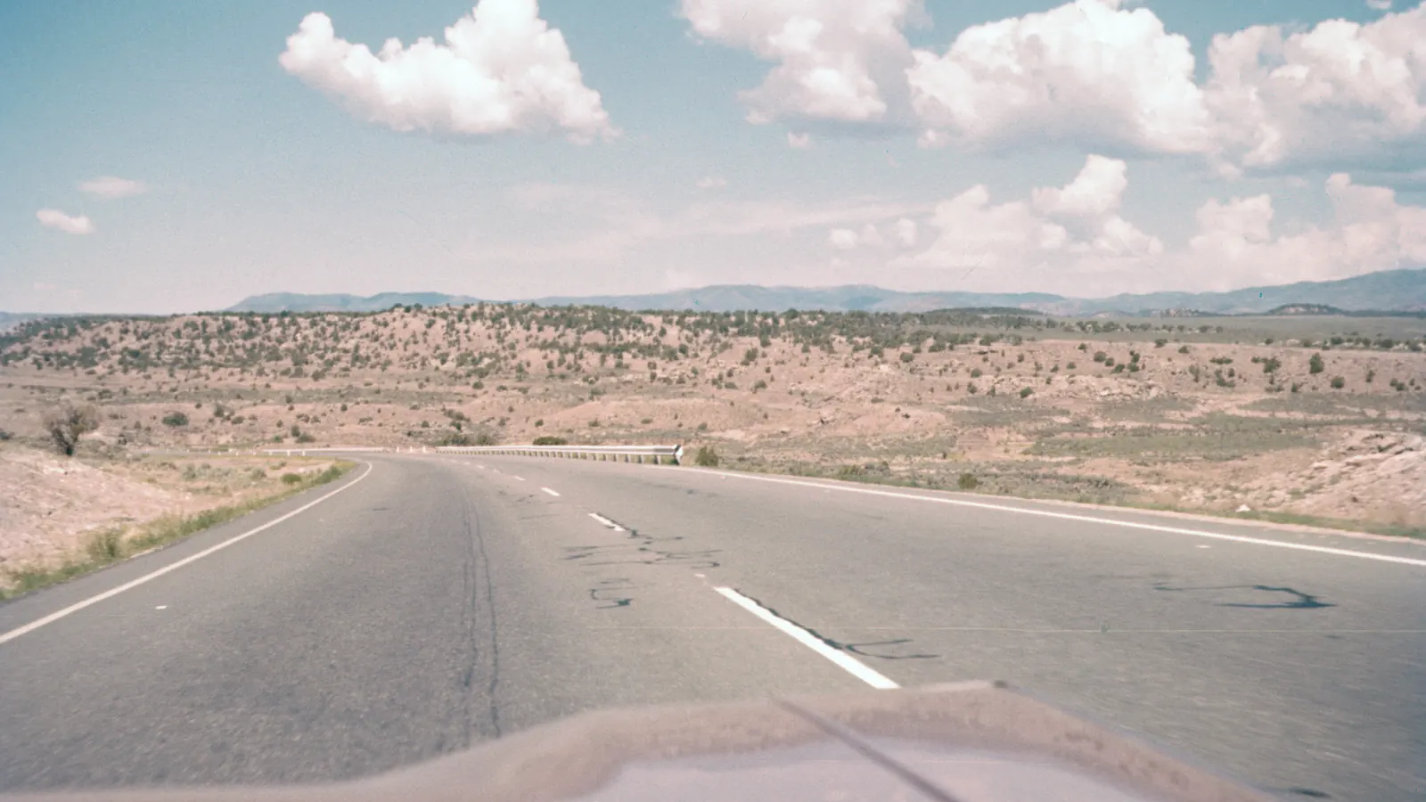 Open road through a dry landscape